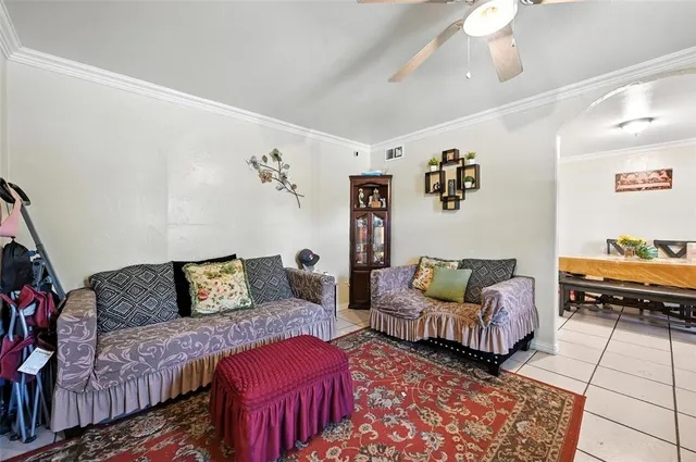 a living room with furniture and a rug