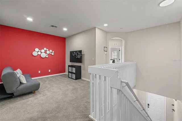 an aerial view of a house with swimming pool and patio