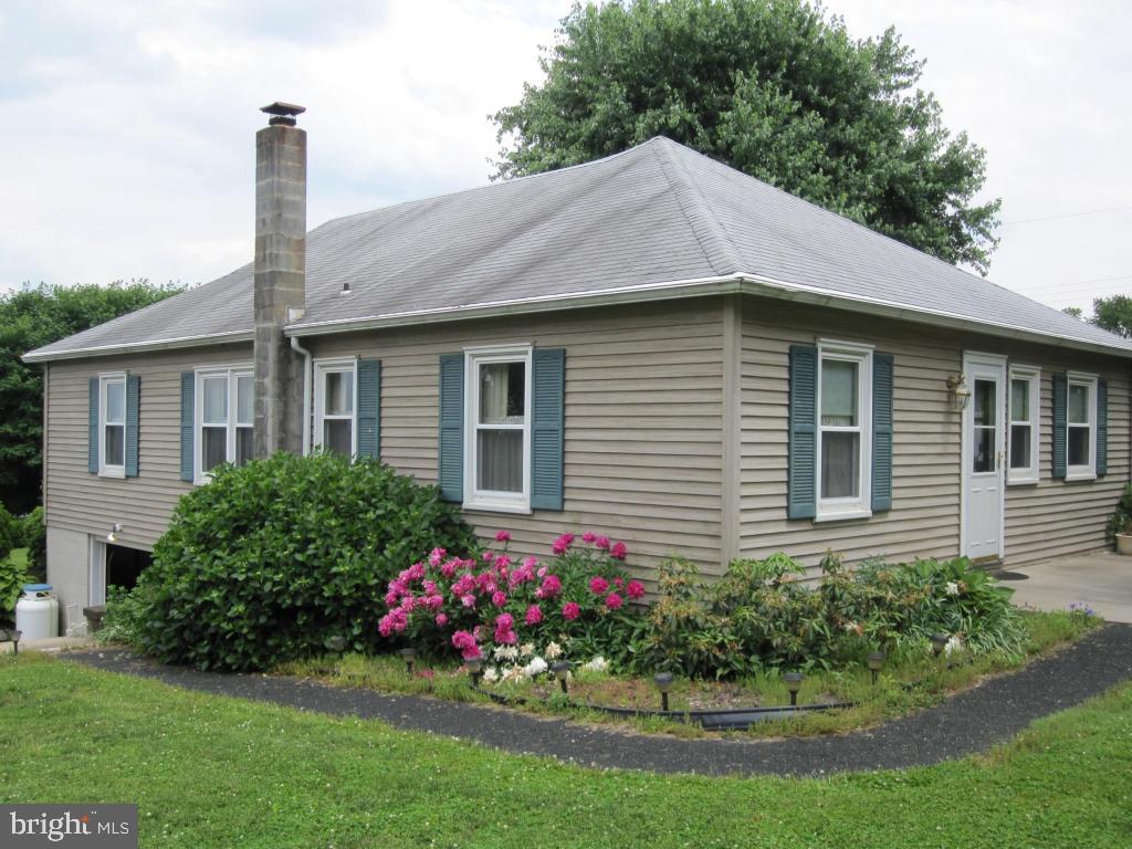 971 Letort Road Washington Boro, PA 17582 - Photo 5 of 29 a front view of a house with a garden
