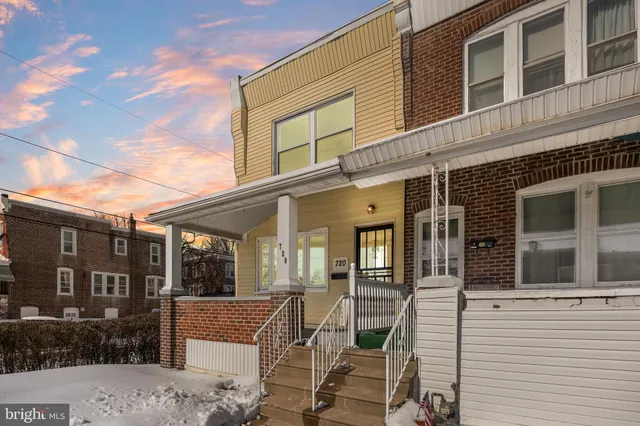 a view of a house with a bench
