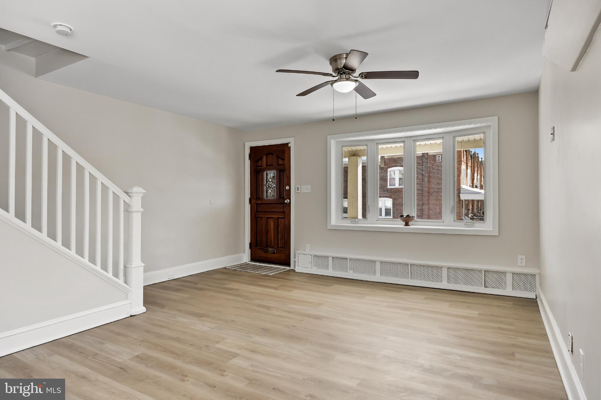 720 West 11th Street Chester, PA 19013 - Photo 9 of 33 a view of an empty room with wooden floor and a window