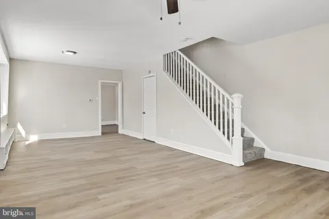 a view of an entryway with wooden floor