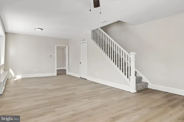 a view of an entryway with wooden floor