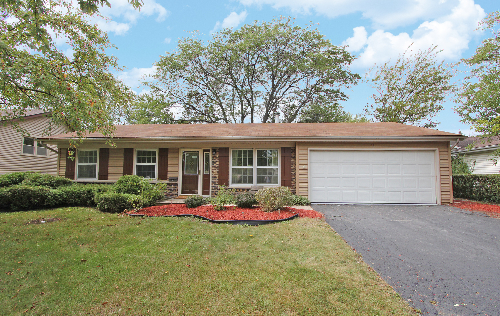 65 Old Mill Grove Road Lake Zurich, IL 60047 - Photo 1 of 29 a front view of house with yard outdoor seating and green space