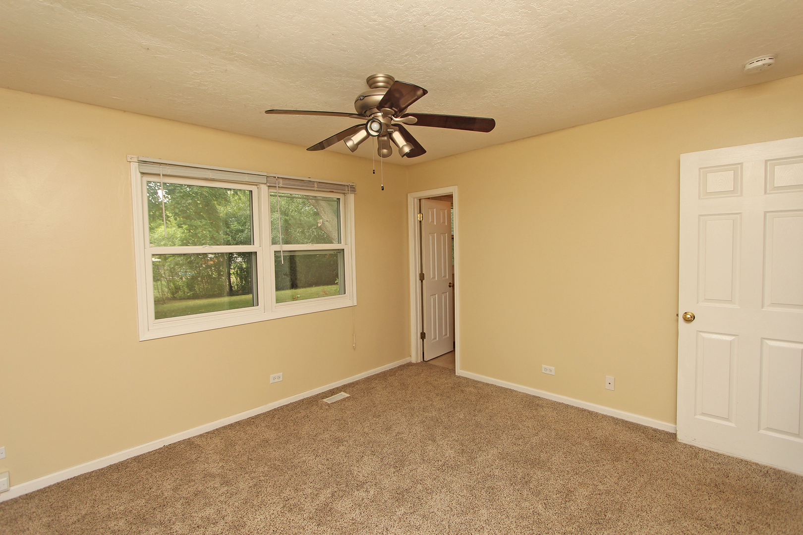 65 Old Mill Grove Road Lake Zurich, IL 60047 - Photo 18 of 29 a view of an empty room with a window