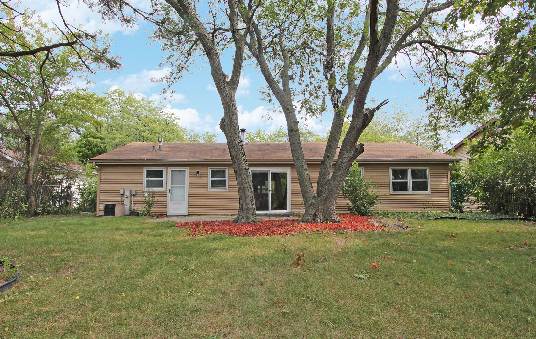 65 Old Mill Grove Road Lake Zurich, IL 60047 - Photo 26 of 29 a front view of house with yard and green space