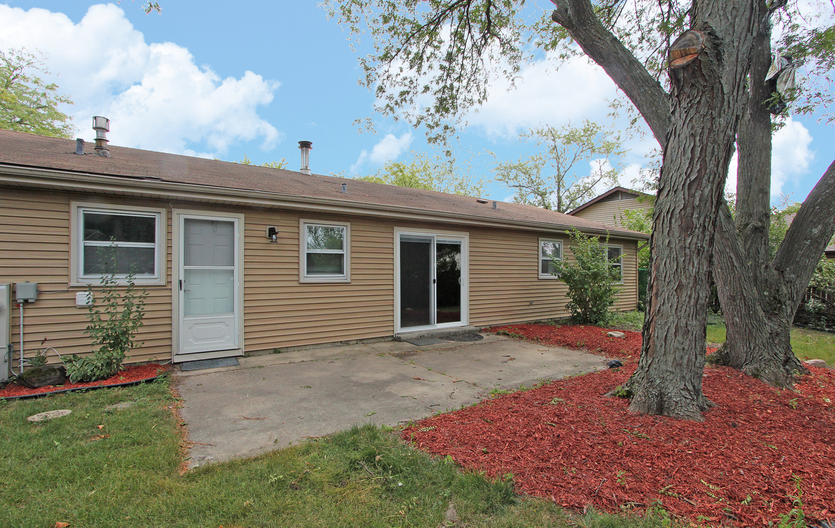 65 Old Mill Grove Road Lake Zurich, IL 60047 - Photo 27 of 29 a front view of house with yard and green space