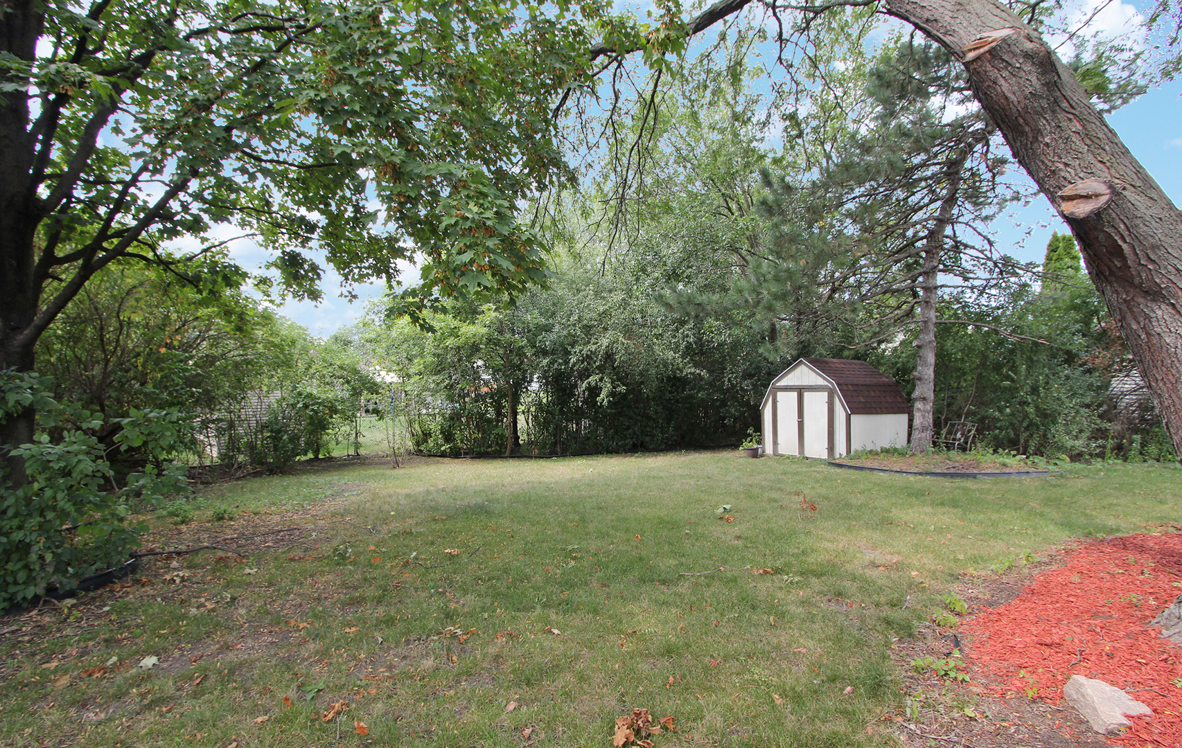 65 Old Mill Grove Road Lake Zurich, IL 60047 - Photo 28 of 29 a view of a big yard with large trees