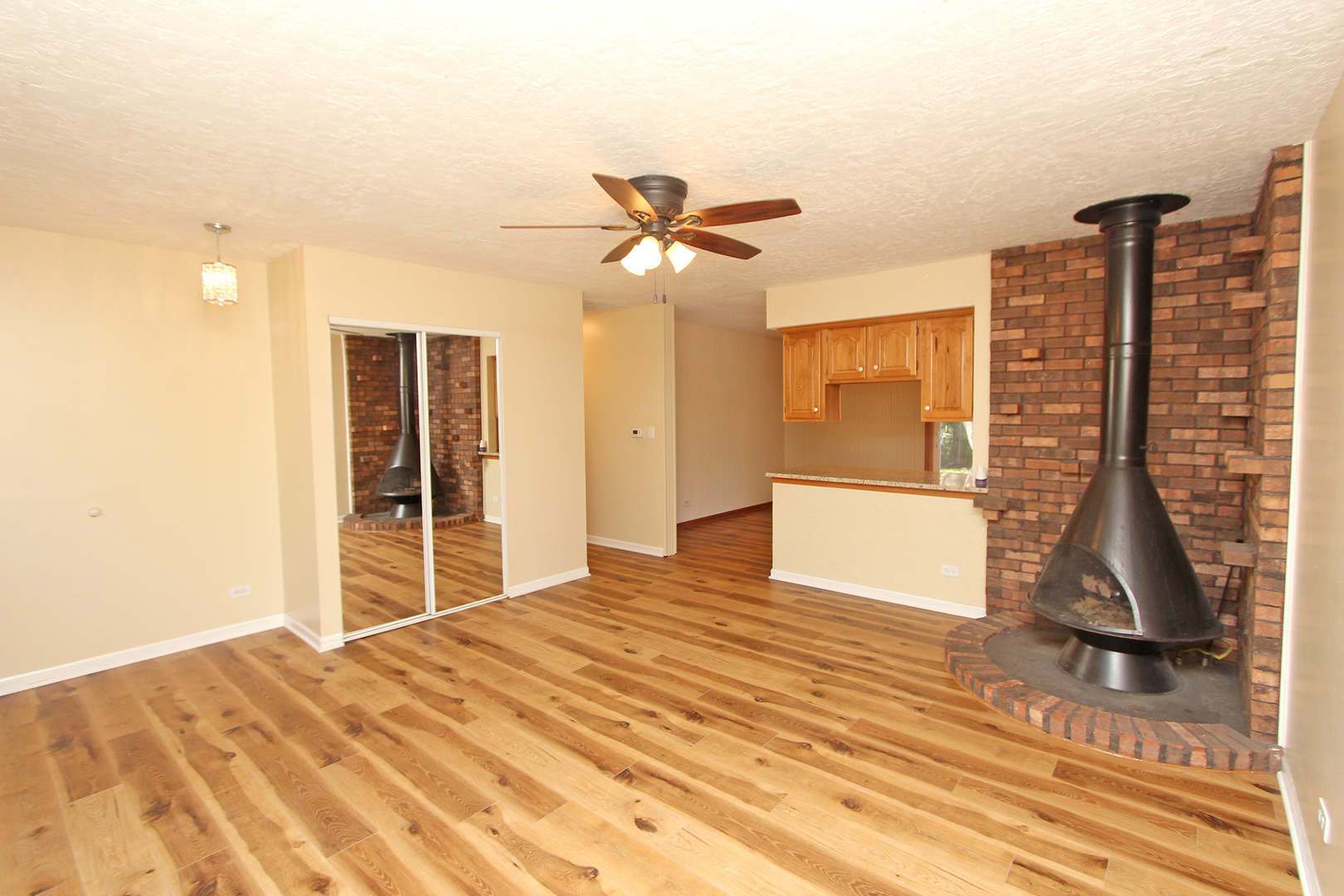 65 Old Mill Grove Road Lake Zurich, IL 60047 - Photo 4 of 29 a view of a bedroom with a bed and wooden floor