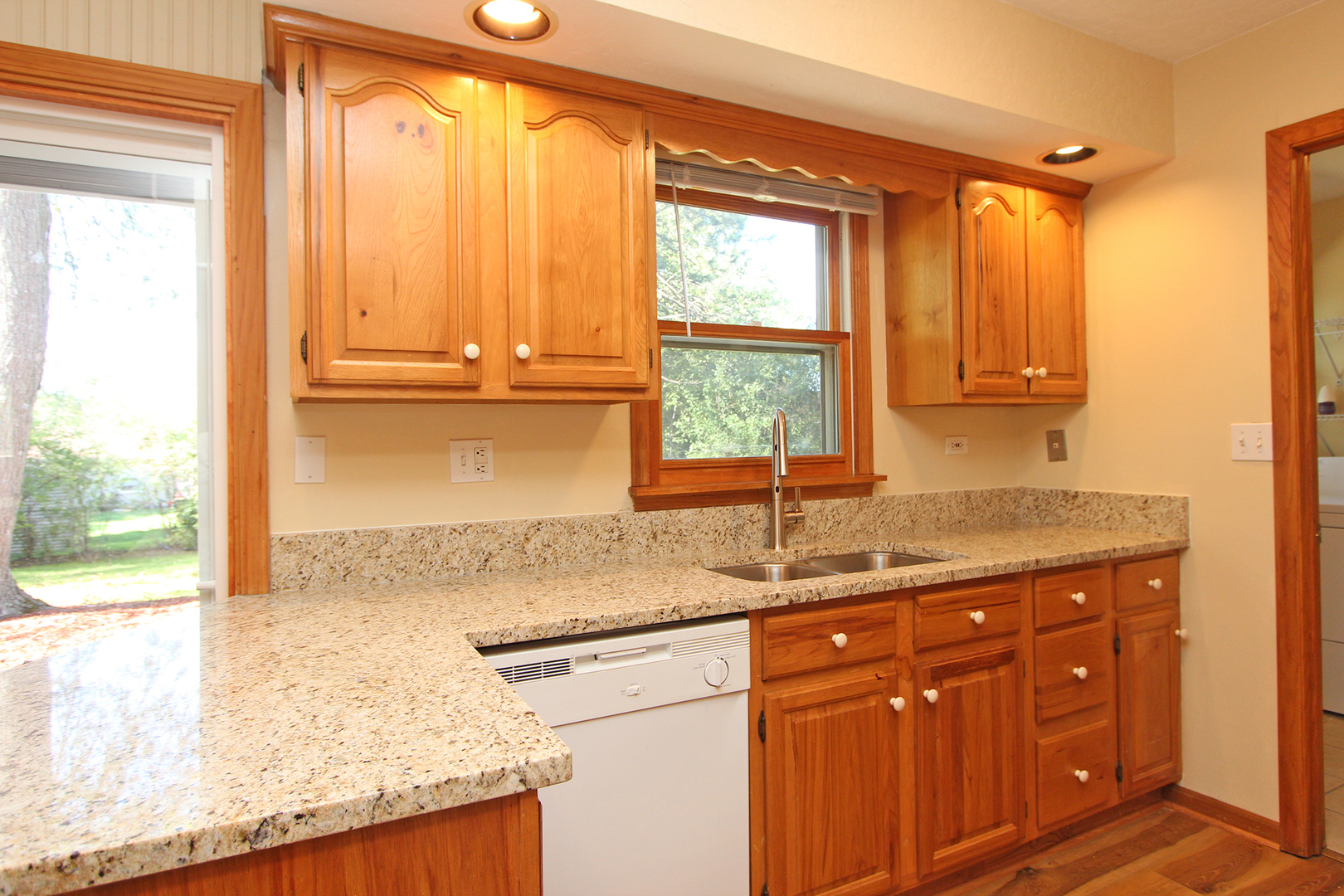 65 Old Mill Grove Road Lake Zurich, IL 60047 - Photo 9 of 29 a kitchen with granite countertop a sink a window and a granite counter tops