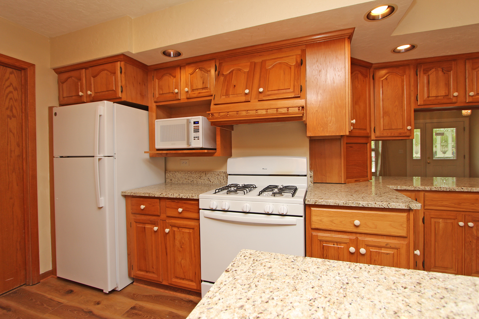 65 Old Mill Grove Road Lake Zurich, IL 60047 - Photo 10 of 29 a kitchen with stainless steel appliances granite countertop a refrigerator stove and cabinets