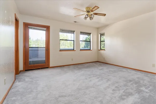 a view of balcony with wooden floor