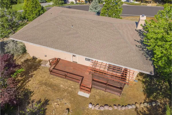 an aerial view of a house with a yard
