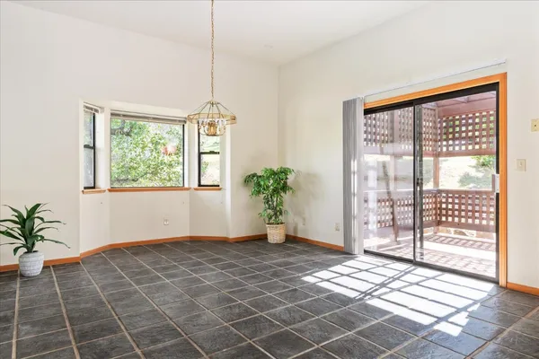 a room with stainless steel appliances a sink a counter top space and cabinets
