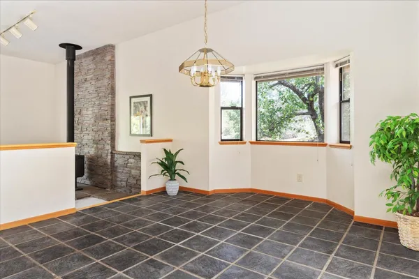 a kitchen with stainless steel appliances granite countertop a sink and a stove