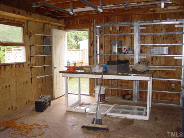 8116 Bacon Road Timberlake, NC 27583 - Photo 11 of 15 Awesome storage shelving and work benches in this barn....perfect for the handyman.