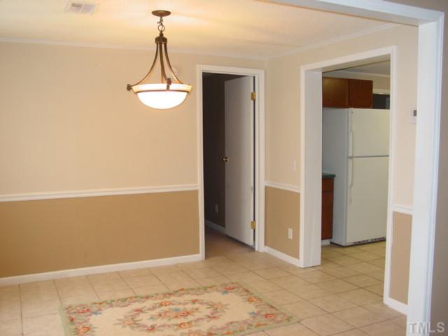 8116 Bacon Road Timberlake, NC 27583 - Photo 4 of 15 Tiled floor separate dining room...just off the kitchen for easy access.