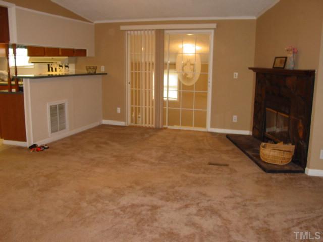 8116 Bacon Road Timberlake, NC 27583 - Photo 5 of 15 Another view of the spacious living room...open plan has access to the kitchen, dining room and bonus room. Additional bar area...just add seating and you will have a breakfast bar.
