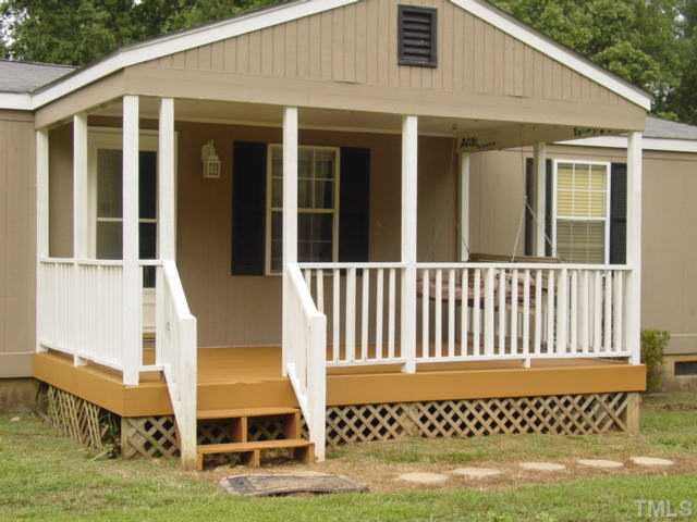8116 Bacon Road Timberlake, NC 27583 - Photo 7 of 15 Covered front porch...relax and enjoy this peaceful setting.