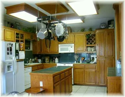 a kitchen with a sink cabinets and window