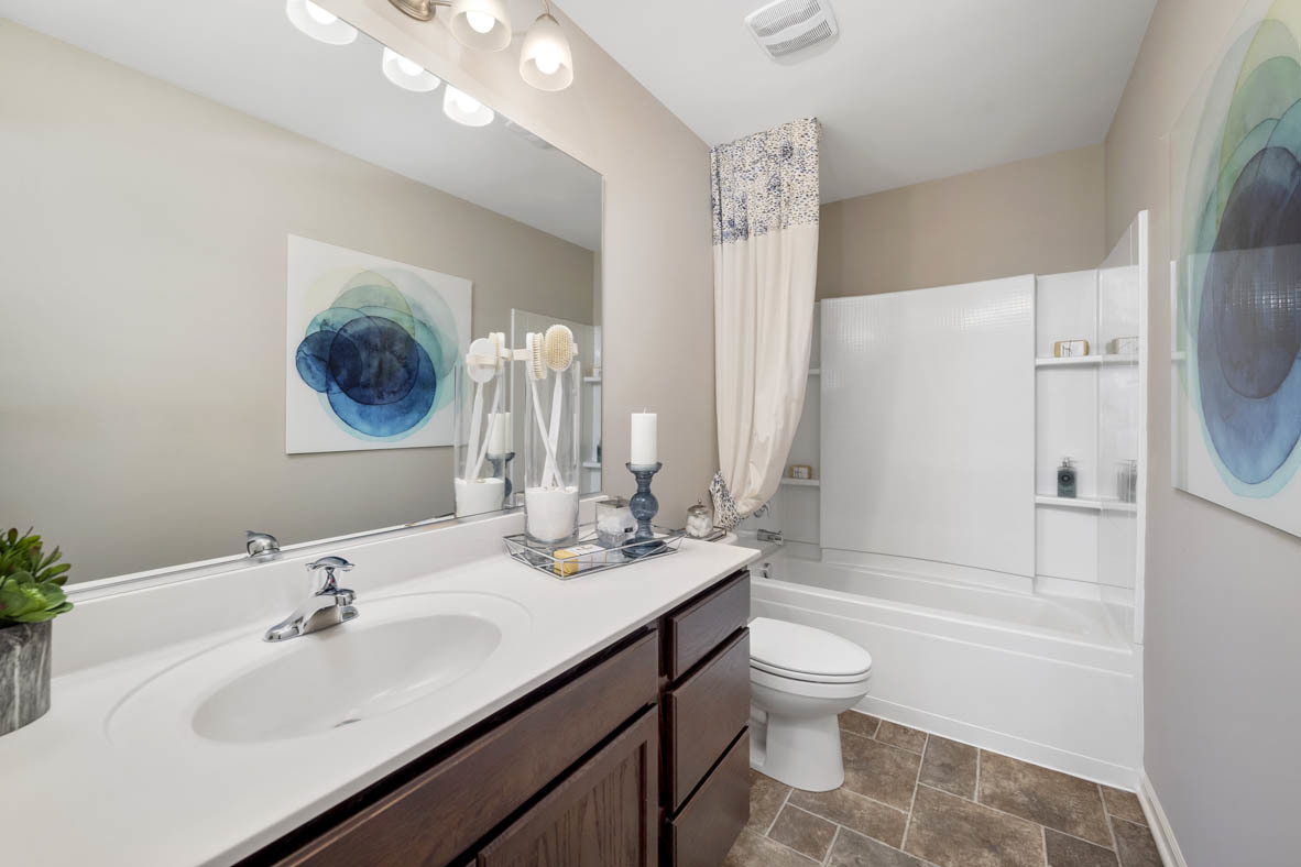 3728 Bailey Road Yorkville, IL 60560 - Photo 12 of 16 a bathroom with a granite countertop sink toilet a mirror and shower