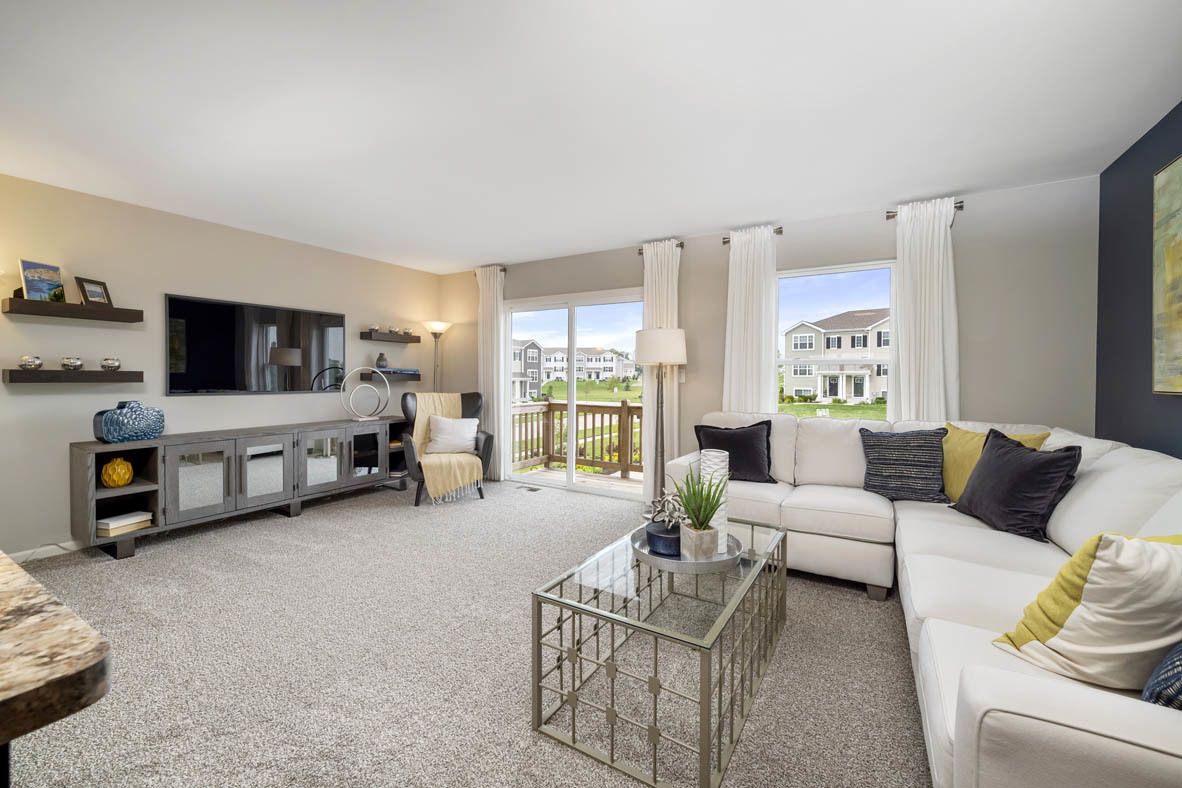 3728 Bailey Road Yorkville, IL 60560 - Photo 8 of 16 a living room with furniture and a flat screen tv
