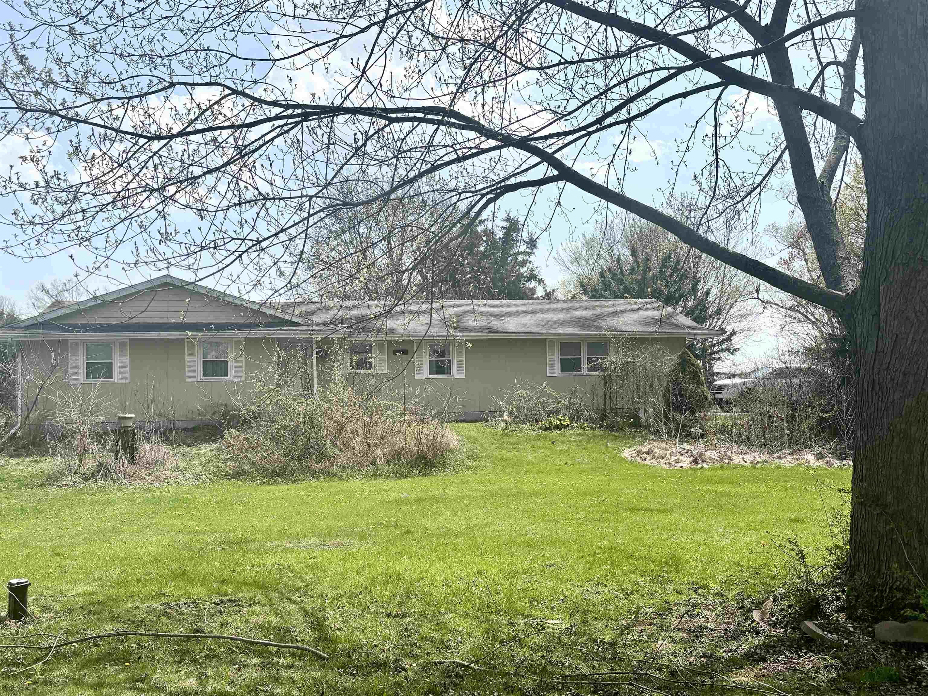 8029 Huber Road Belvidere, IL 61008 - Photo 1 of 35 a front view of a house with garden