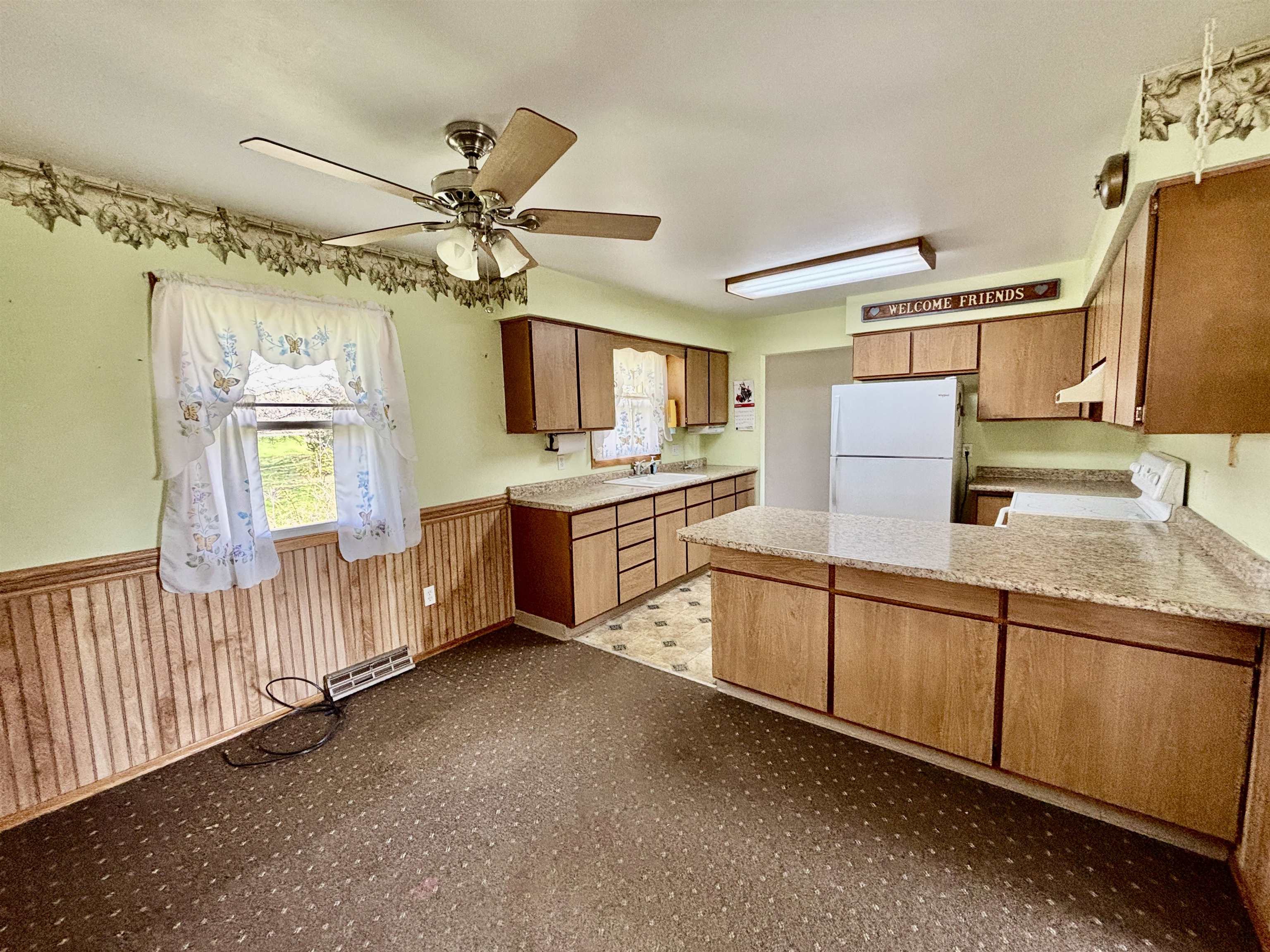 8029 Huber Road Belvidere, IL 61008 - Photo 8 of 35 a kitchen with cabinets a sink and appliances