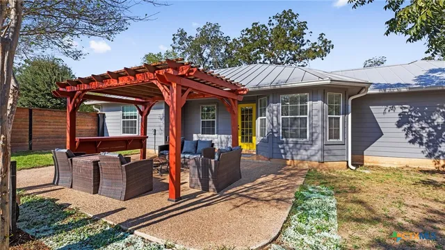 a view of a chairs and tables in the patio