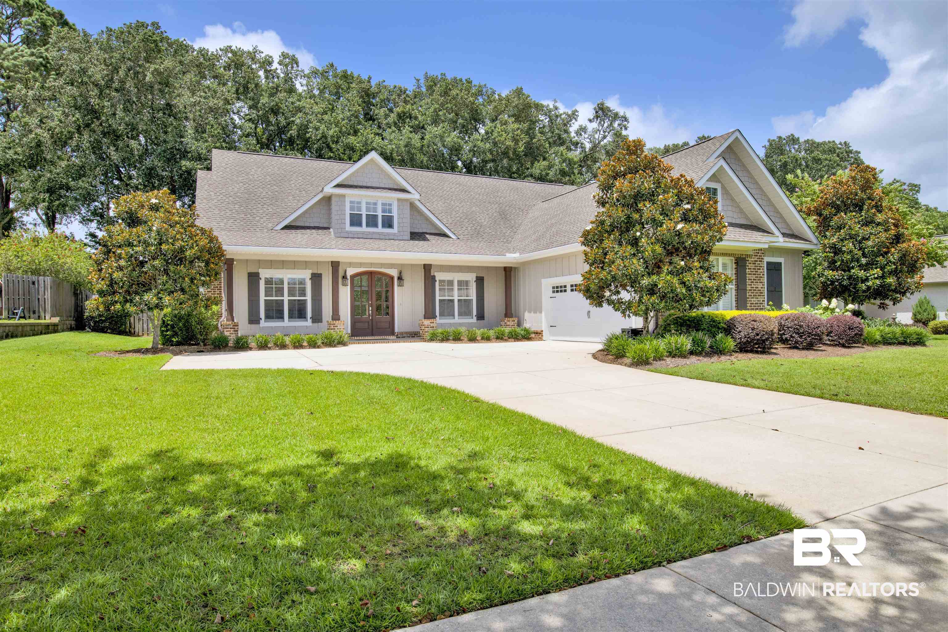 131 Sedgefield Avenue Fairhope, AL 36532 - Photo 1 of 50 Craftsman-style house with a garage and a front yard