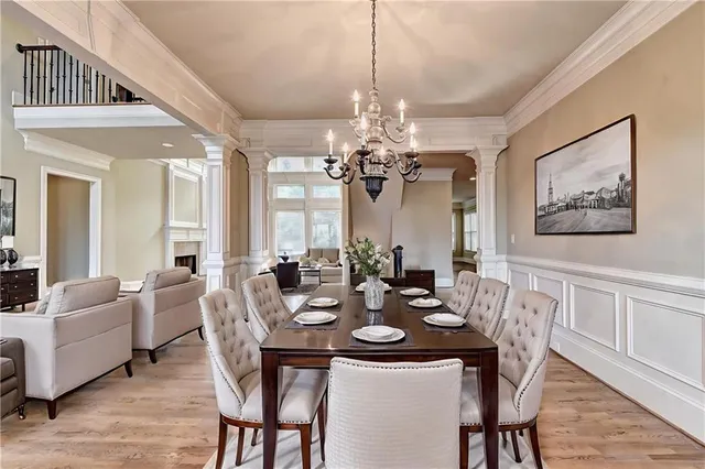 a living room with furniture fireplace and a large window