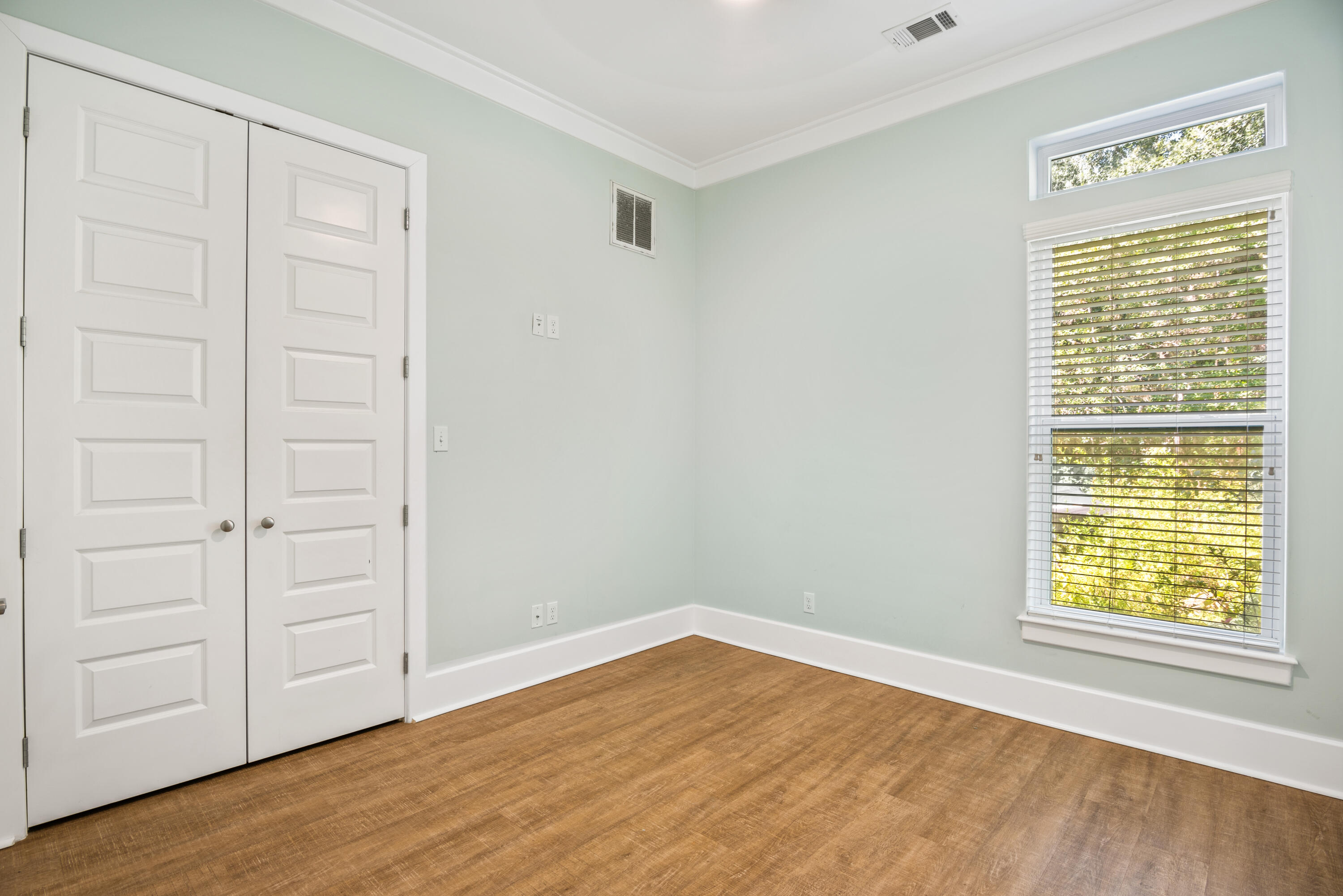 160 Rearden Way Santa Rosa Beach, FL 32459 - Photo 15 of 46 a view of an empty room with wooden floor with windows