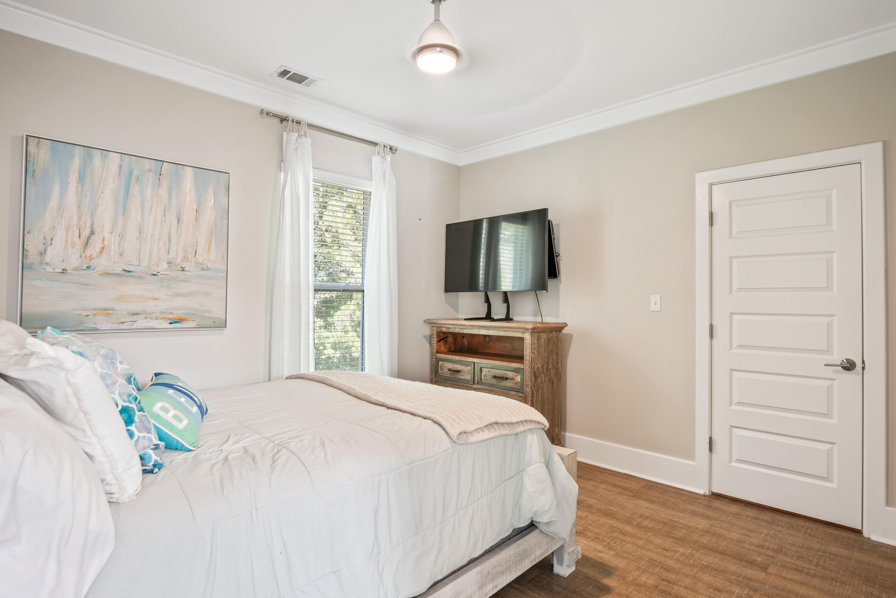 160 Rearden Way Santa Rosa Beach, FL 32459 - Photo 17 of 46 a bedroom with a bed and flat screen tv