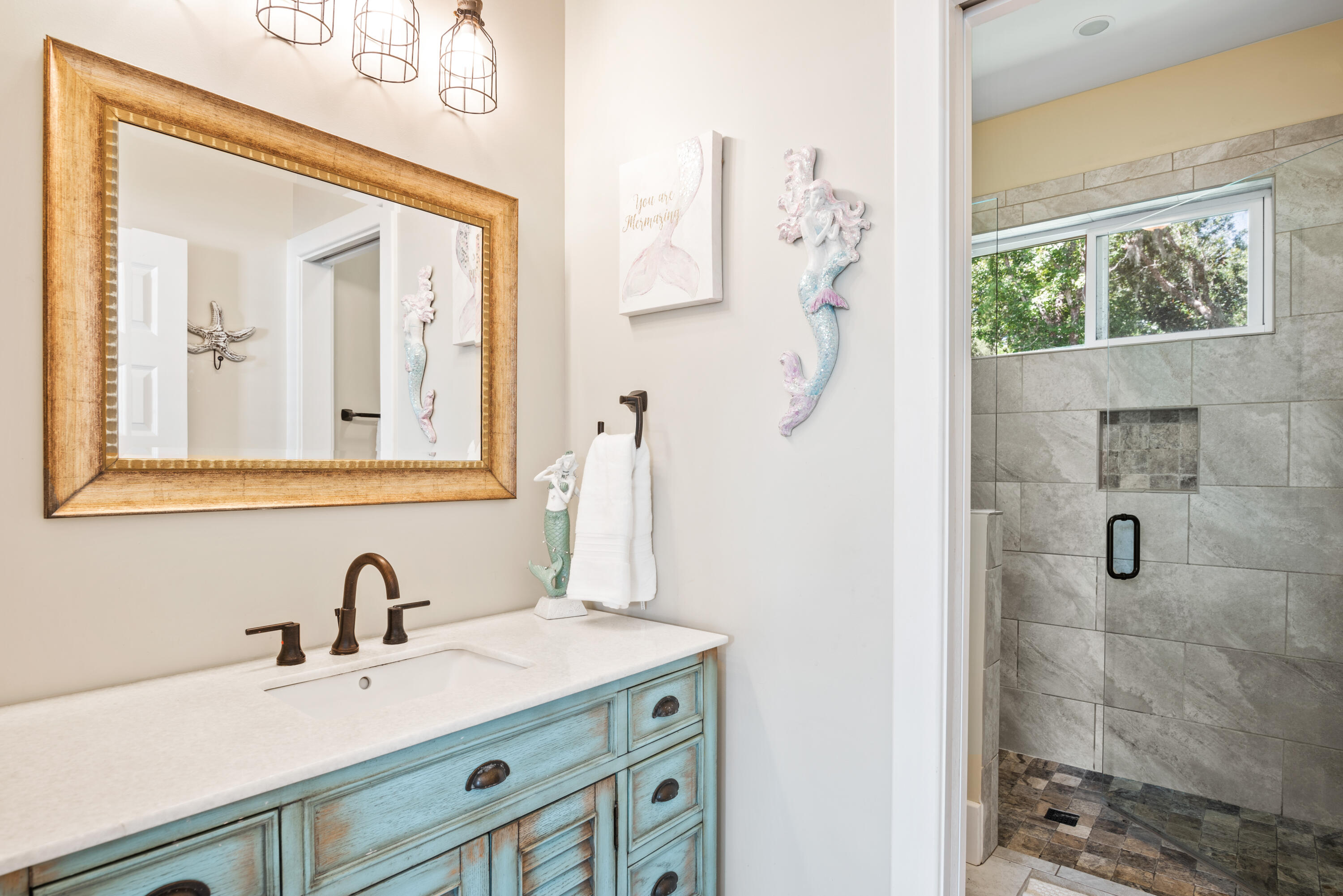 160 Rearden Way Santa Rosa Beach, FL 32459 - Photo 20 of 46 a bathroom with a sink vanity and a mirror