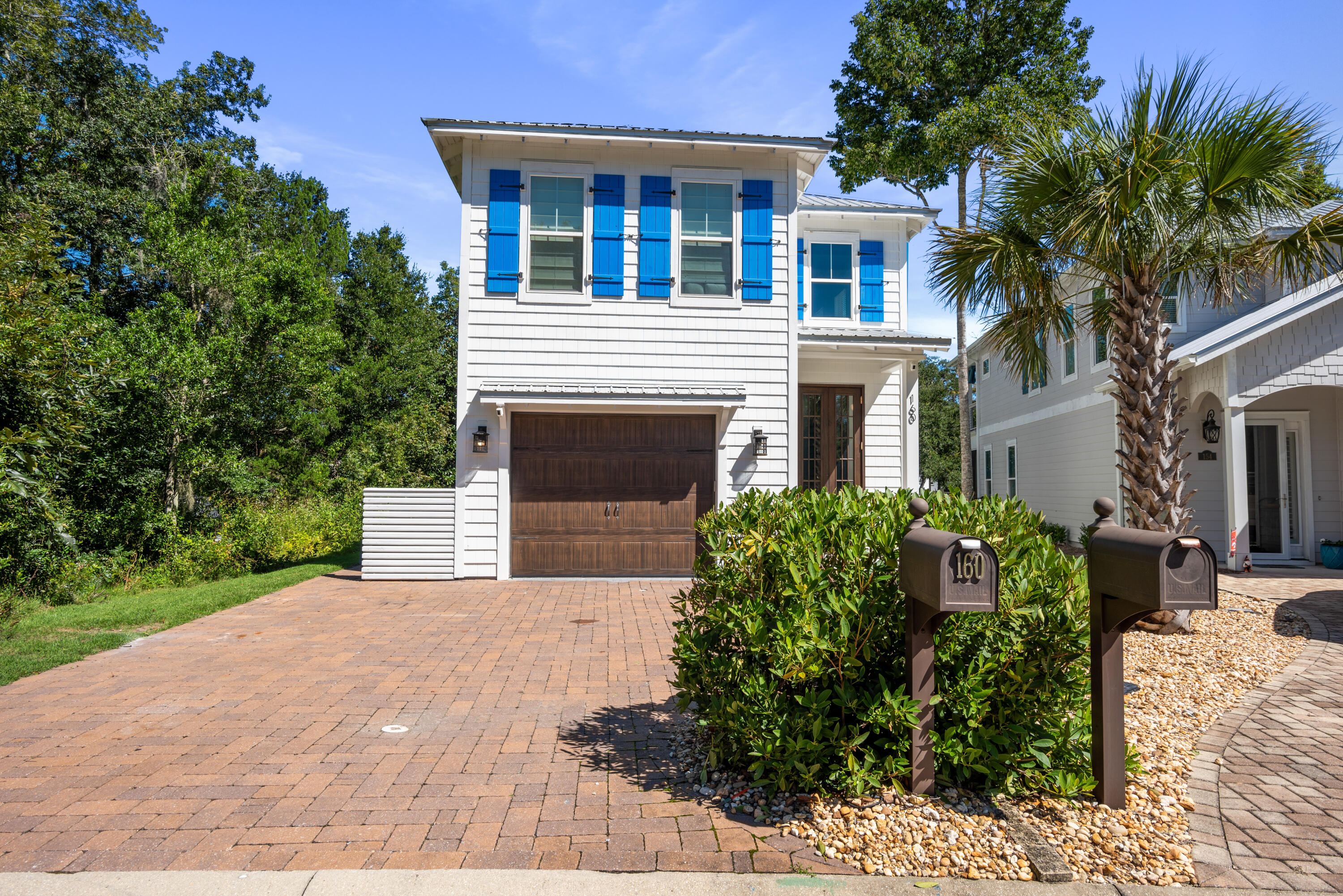 160 Rearden Way Santa Rosa Beach, FL 32459 - Photo 2 of 46 a front view of a house with garden
