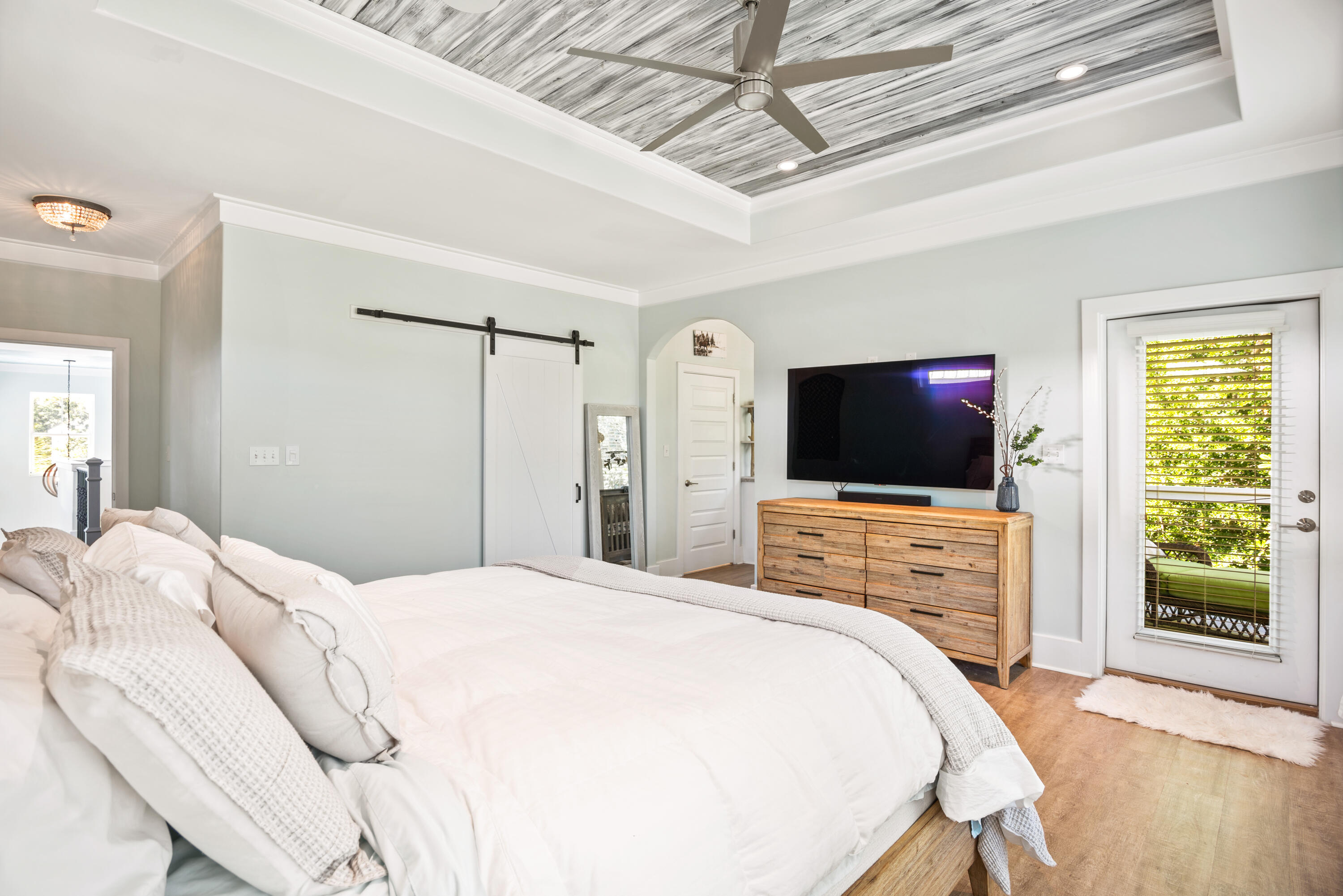 160 Rearden Way Santa Rosa Beach, FL 32459 - Photo 21 of 46 a bedroom with a bed and a flat screen tv