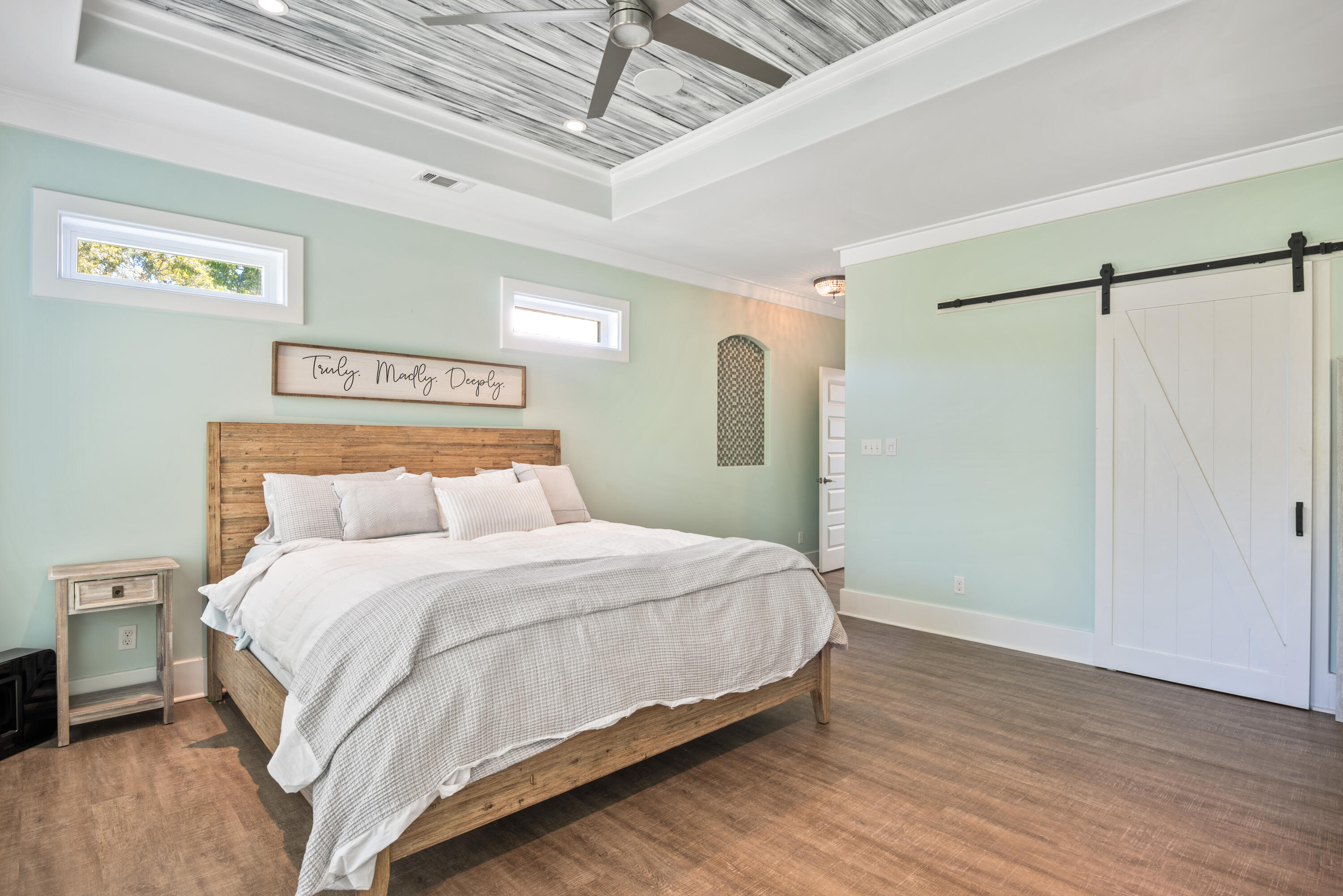 160 Rearden Way Santa Rosa Beach, FL 32459 - Photo 23 of 46 a bedroom with a bed and a table