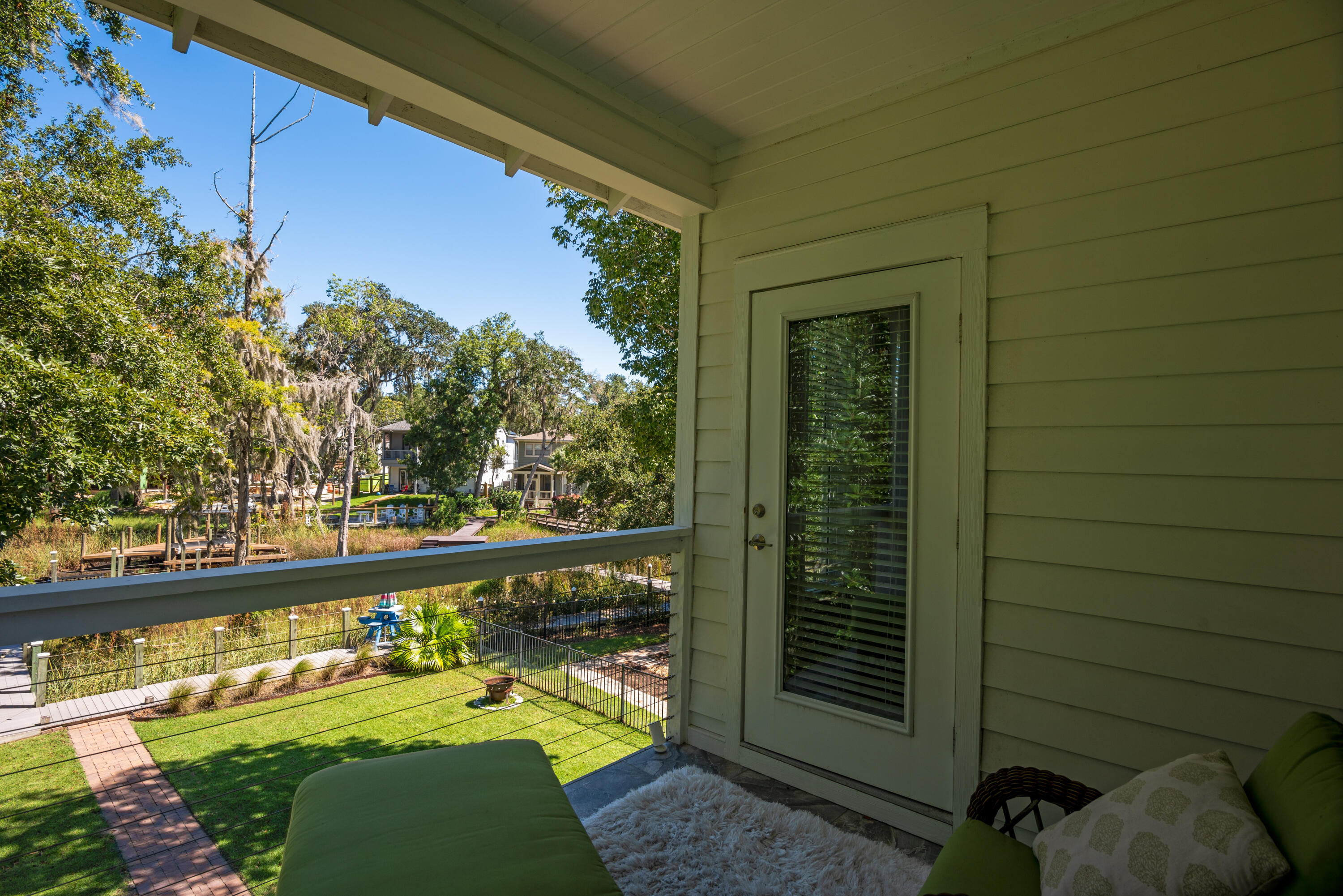 160 Rearden Way Santa Rosa Beach, FL 32459 - Photo 28 of 46 a view of a balcony with floor to ceiling windows with wooden floor