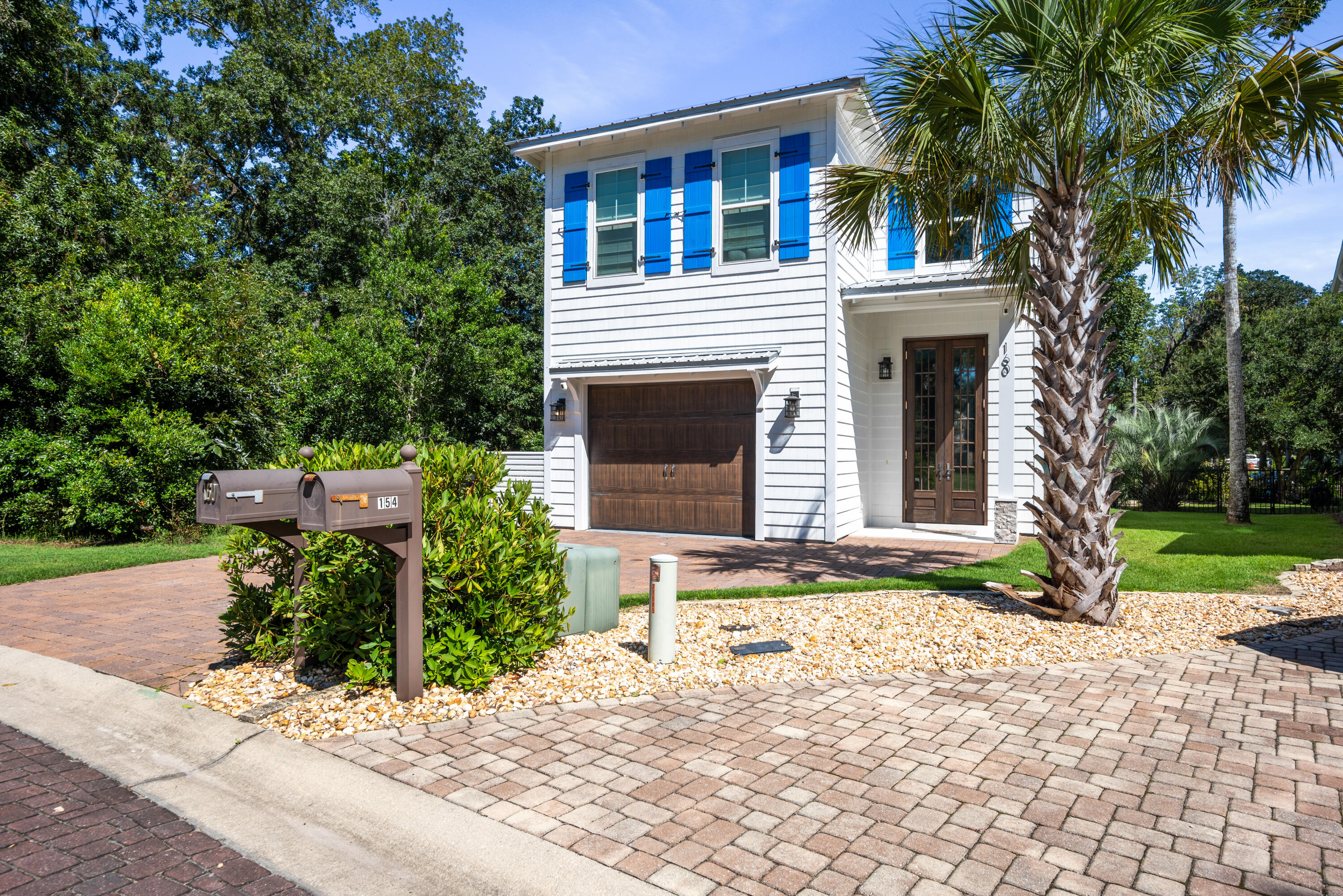 160 Rearden Way Santa Rosa Beach, FL 32459 - Photo 3 of 46 a front view of a house with garden