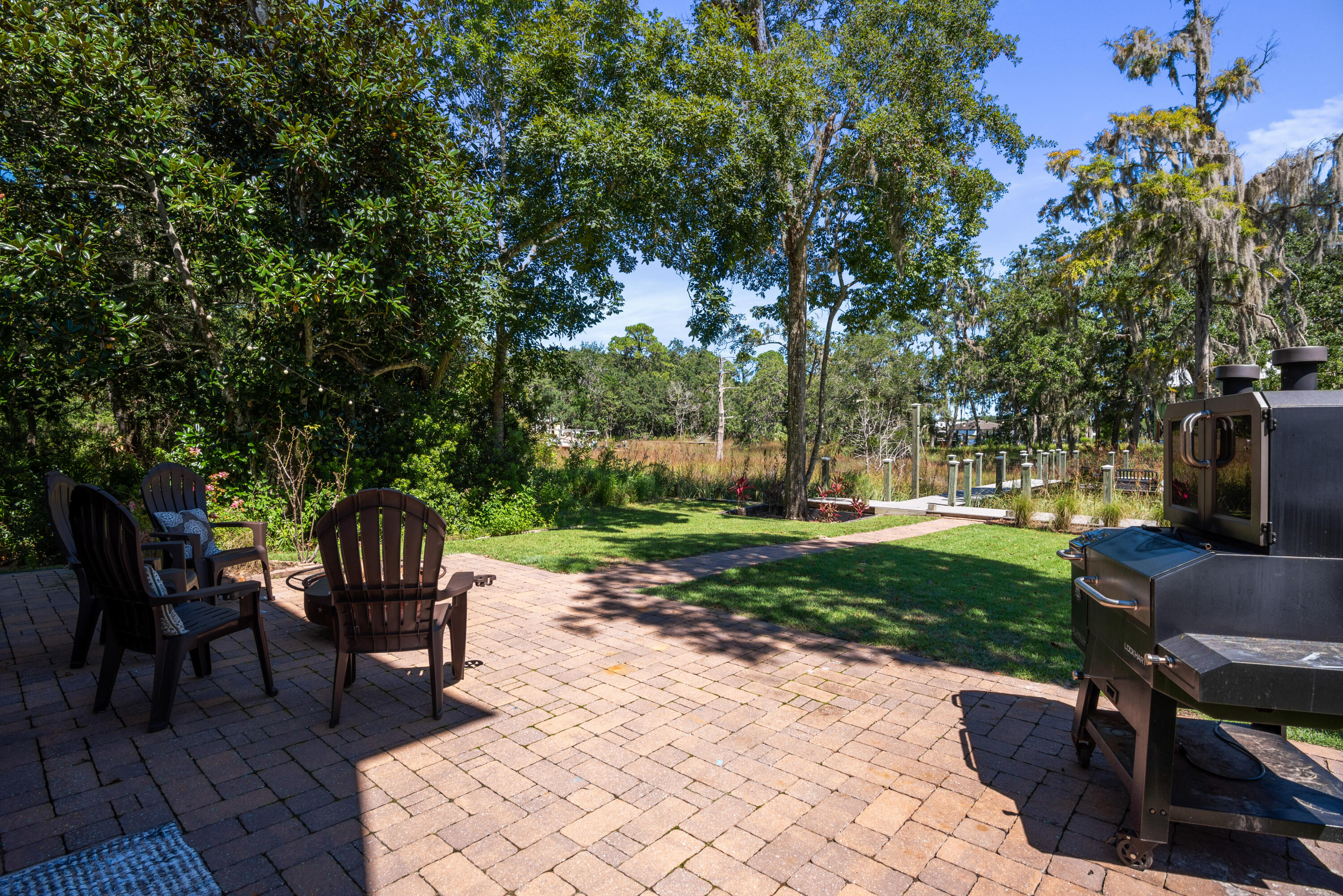 160 Rearden Way Santa Rosa Beach, FL 32459 - Photo 36 of 46 a view of a backyard with sitting area