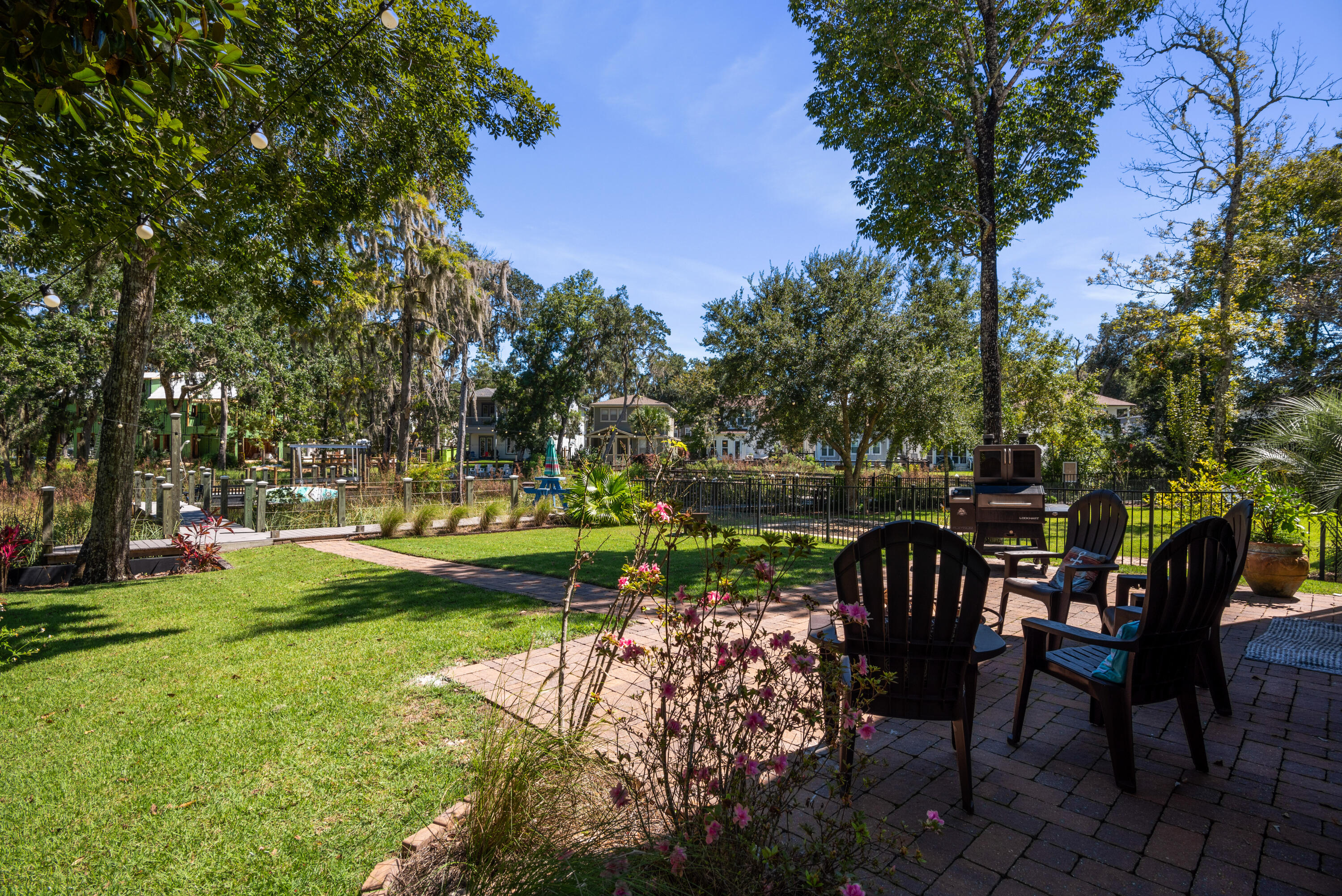160 Rearden Way Santa Rosa Beach, FL 32459 - Photo 37 of 46 a view of a chair and table on the garden