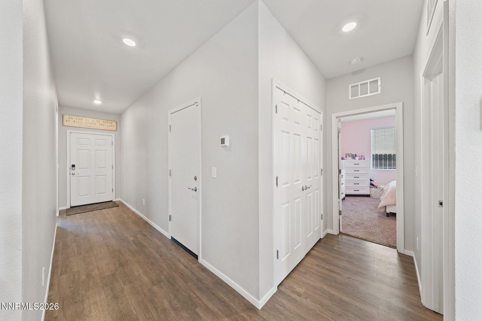9708 Sea Glass Drive Reno, NV 89506 - Photo 12 of 51 a view of a hallway with wooden floor
