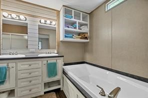 30263 Old Joseph Road Hockley, TX 77447 - Photo 6 of 10 a bathroom with a sink and a mirror