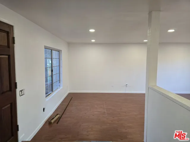 a close view of sink and a dishwasher next to a window