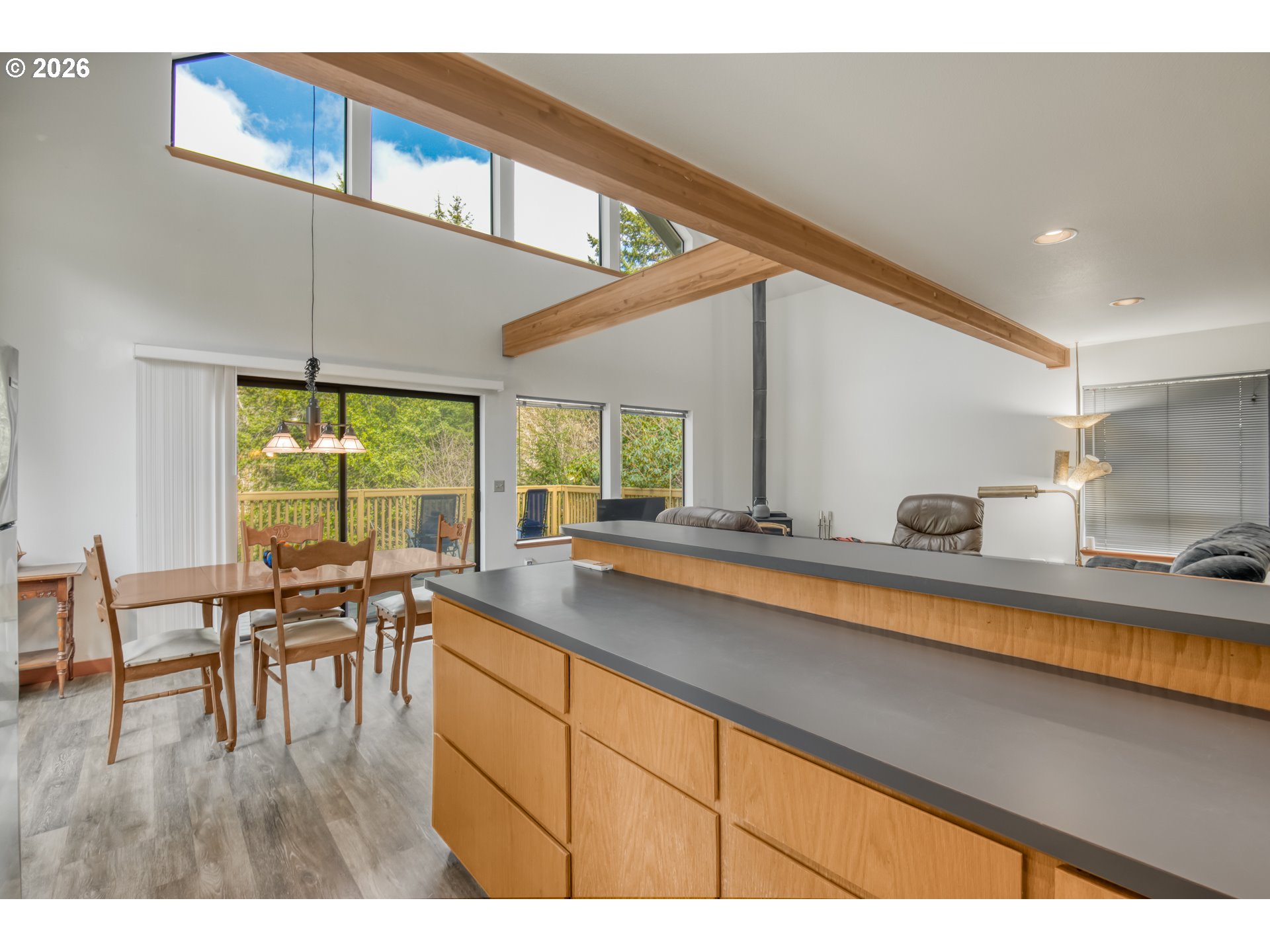 78488 Highway 53 Nehalem, OR 97131 - Photo 13 of 40 a open kitchen with a table and chairs