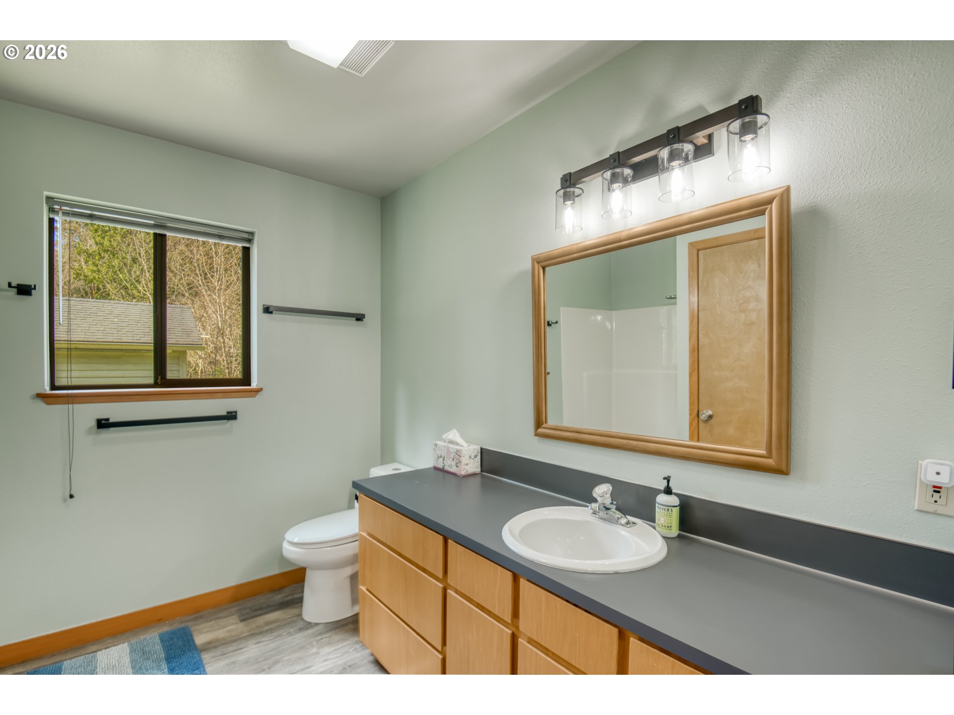 78488 Highway 53 Nehalem, OR 97131 - Photo 14 of 40 a bathroom with a sink and a mirror