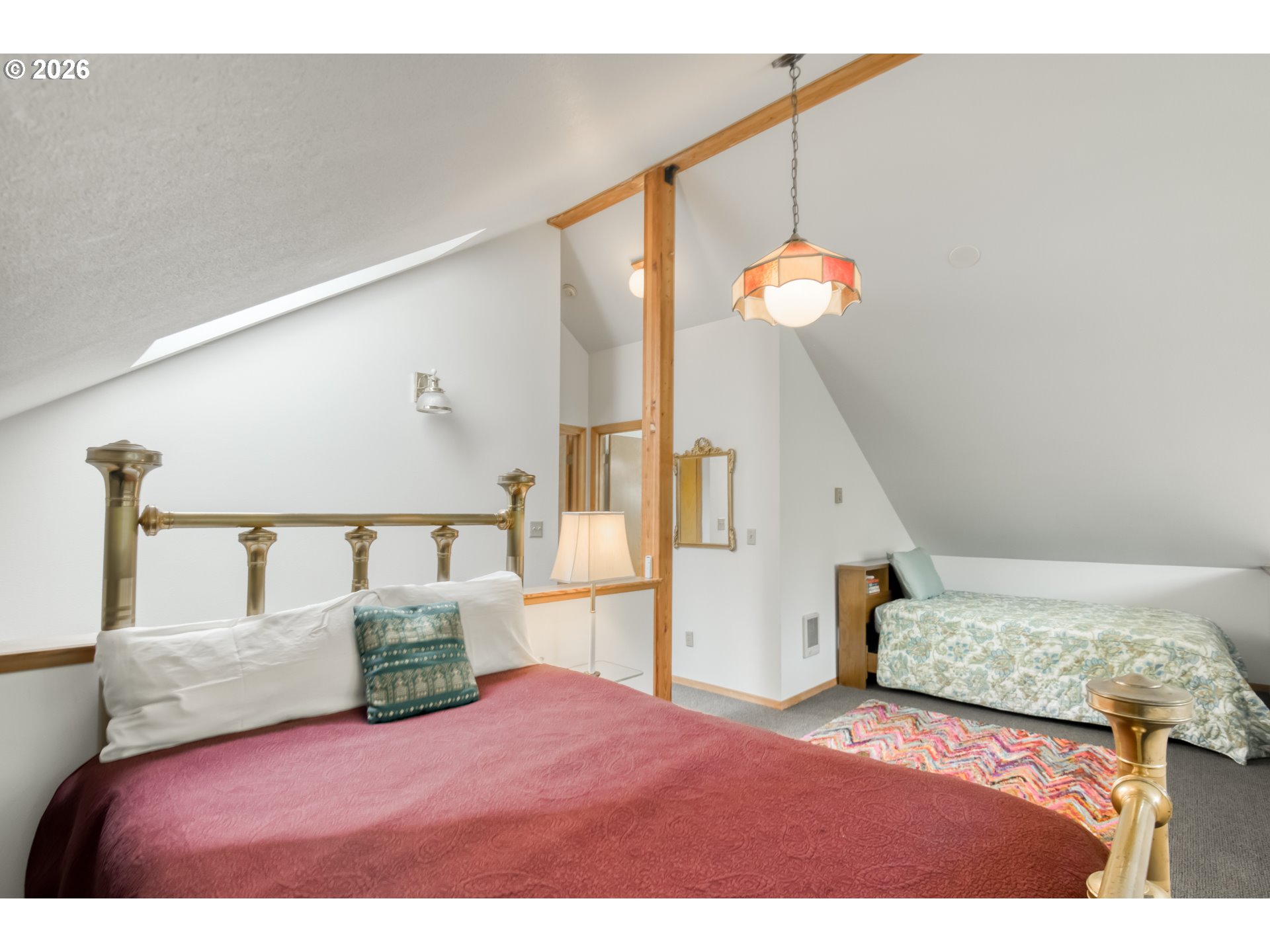 78488 Highway 53 Nehalem, OR 97131 - Photo 17 of 40 a bedroom with a bed and a dresser