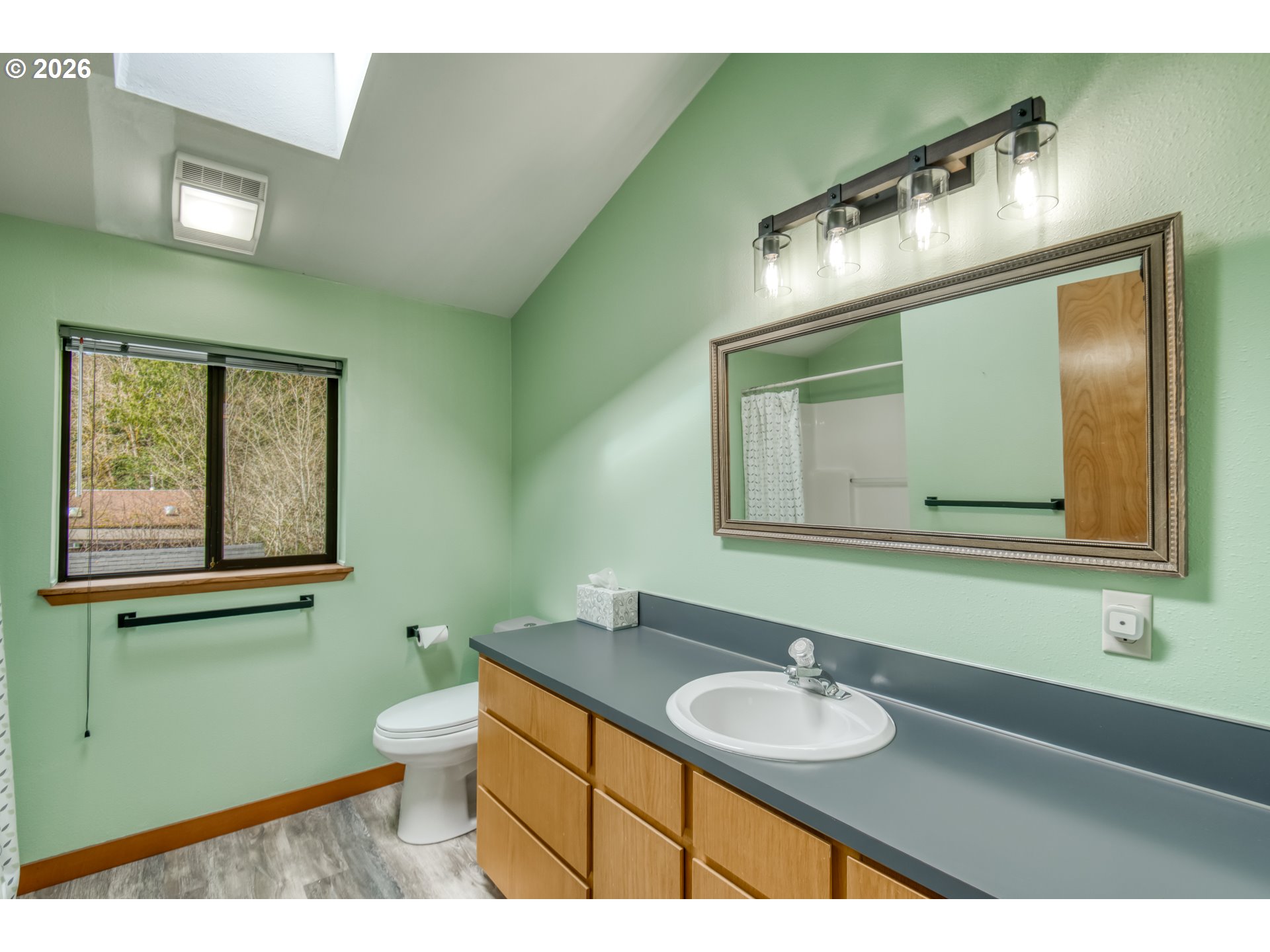 78488 Highway 53 Nehalem, OR 97131 - Photo 19 of 40 a bathroom with a sink and a mirror