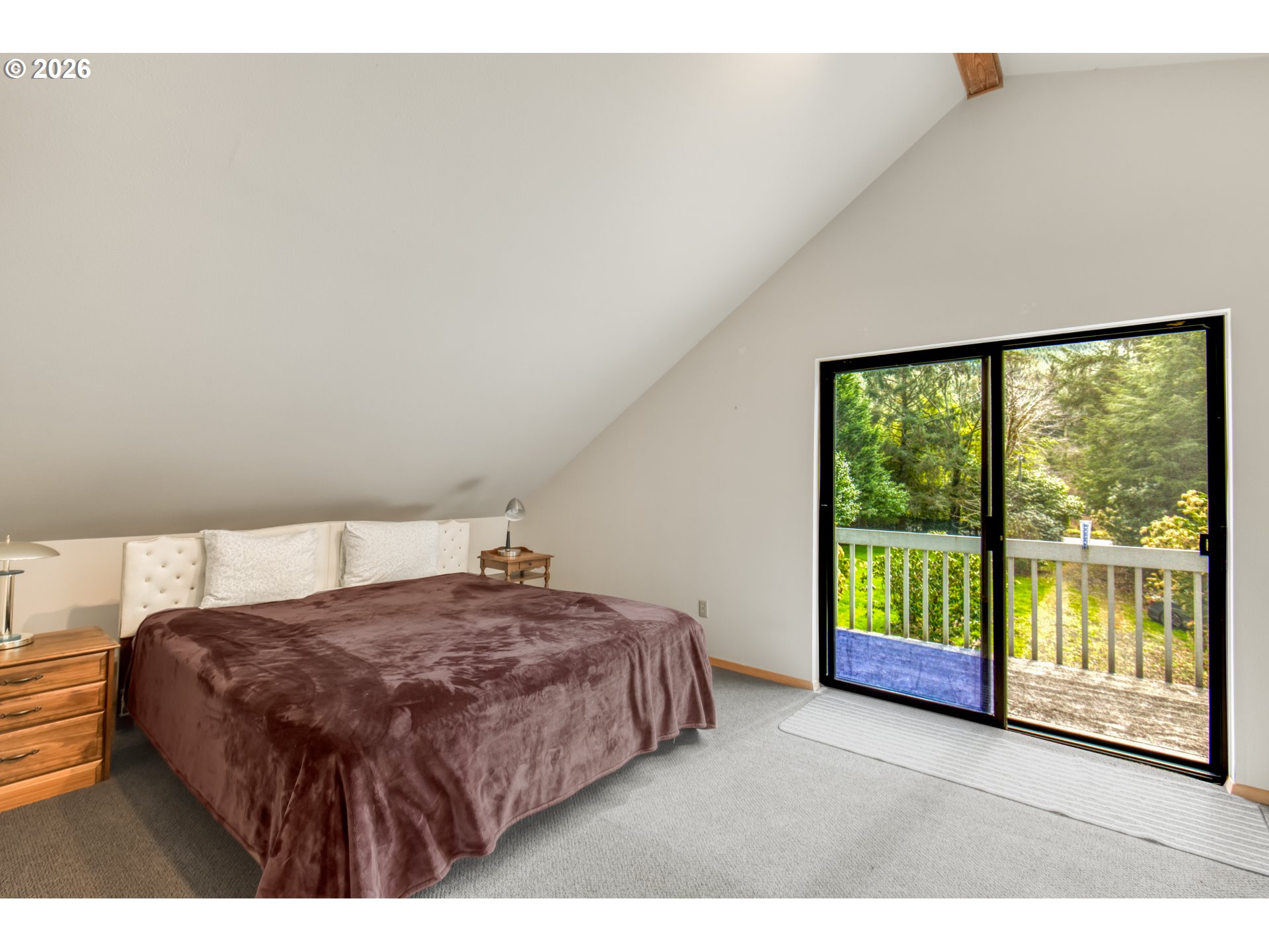 78488 Highway 53 Nehalem, OR 97131 - Photo 20 of 40 a bedroom with a bed and a large window