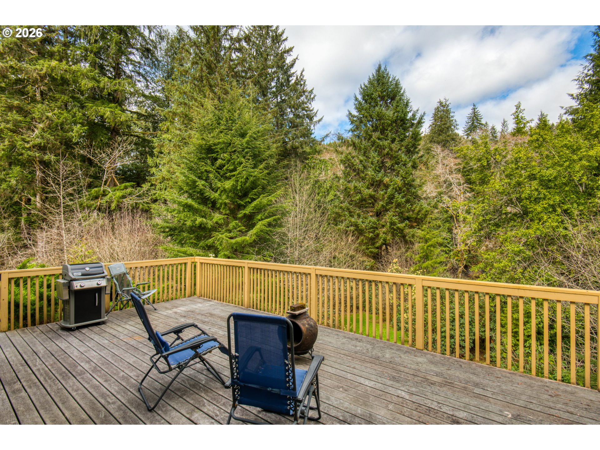 78488 Highway 53 Nehalem, OR 97131 - Photo 24 of 40 a view of a chairs and table on the wooden floor
